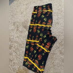 LuLaRoe Black Leggings with Red and Yellow Pattern